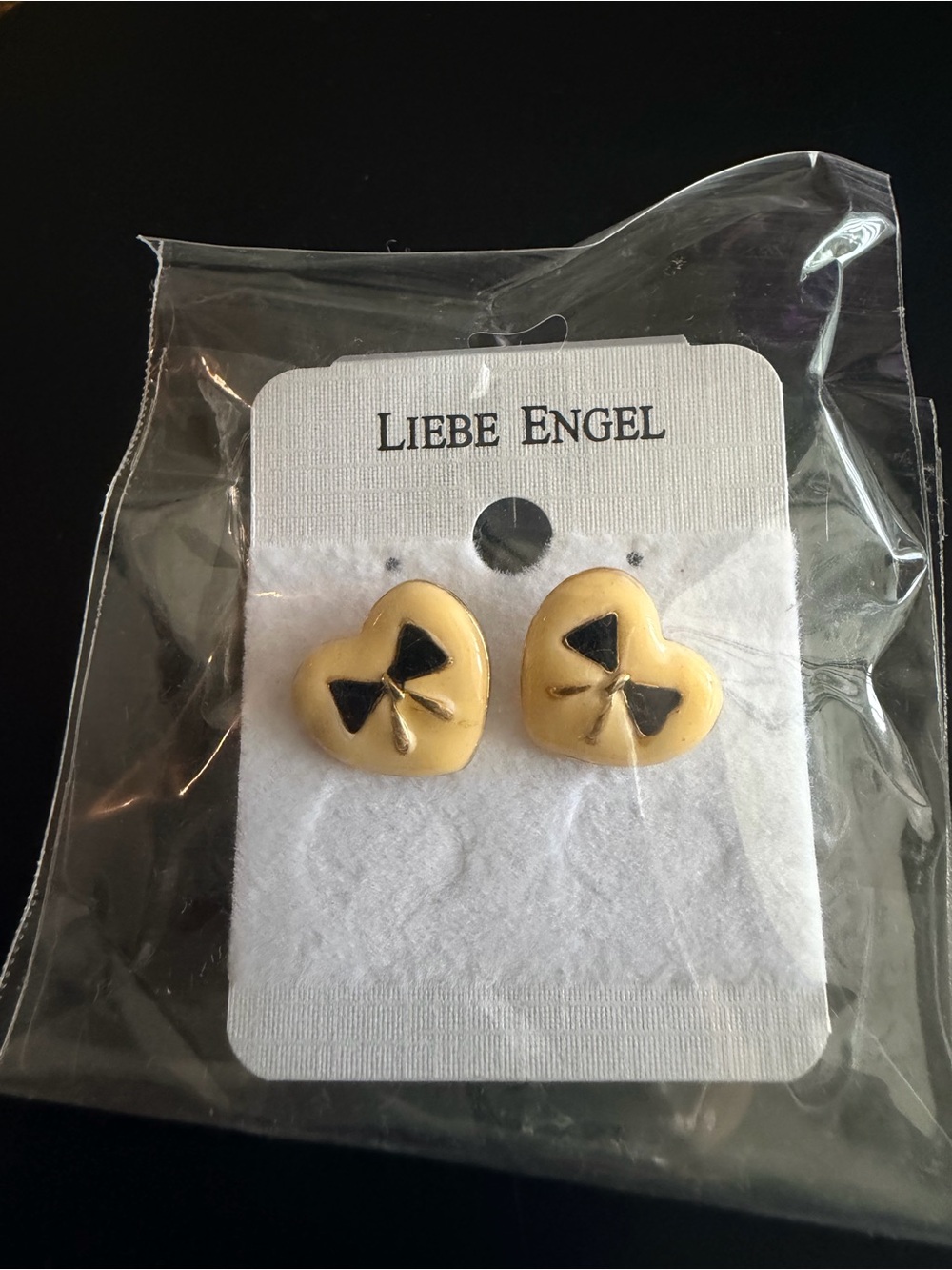 Light Yellow Enamel Heart Stud Earrings with Black Bow Accent
